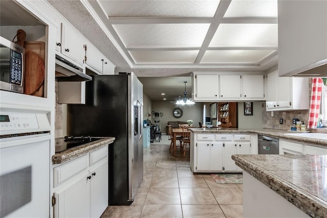 kitchen featuring white cabinetry, decorative light fixtures, kitchen peninsula, stainless steel appliances, and decorative backsplash