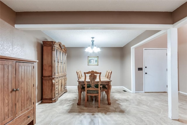 dining room featuring a chandelier