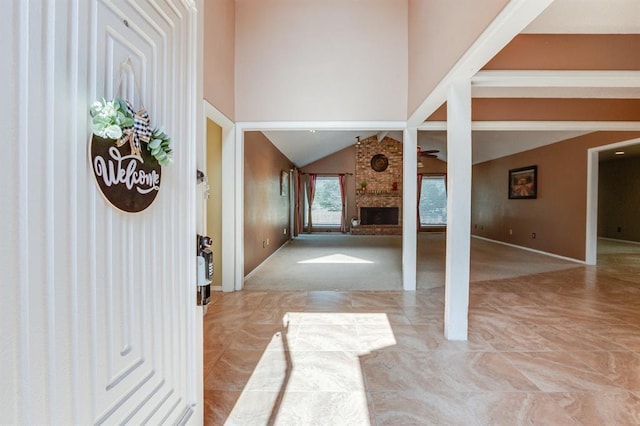 12909 Saint Christopher Dr, Oklahoma City, OK 73120 - entryway with a fireplace, lofted ceiling, baseboards, and ceiling fan