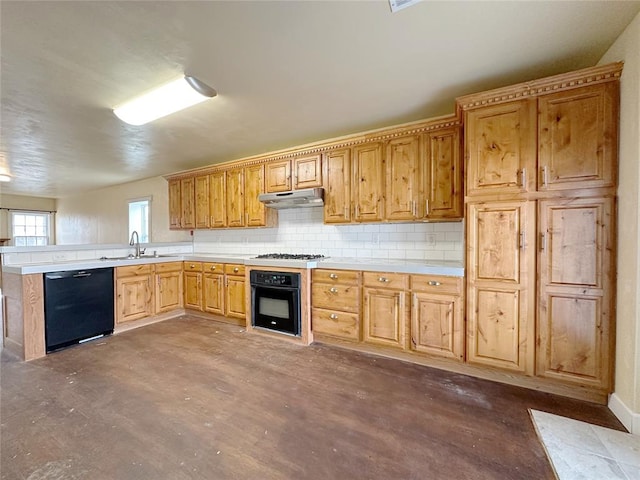 kitchen featuring sink, decorative backsplash, black appliances, and kitchen peninsula