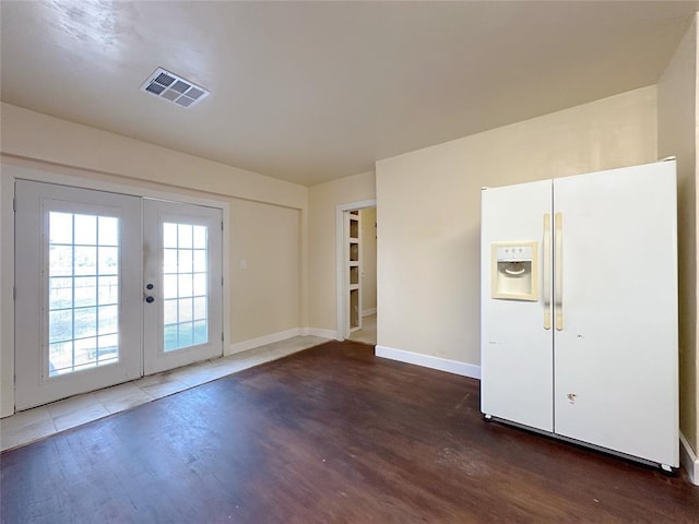 interior space with french doors and dark hardwood / wood-style flooring