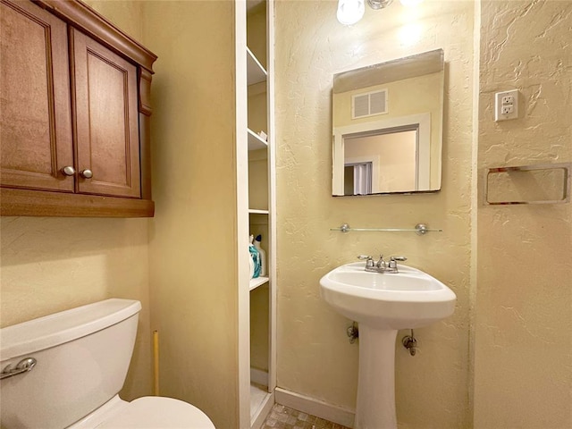 bathroom featuring toilet