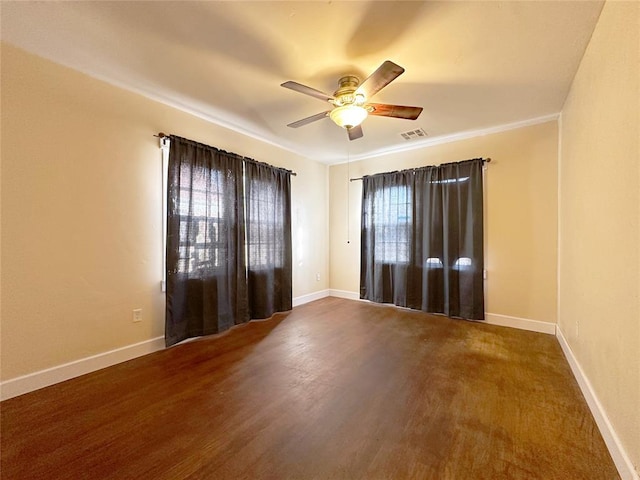 empty room with hardwood / wood-style flooring and ceiling fan