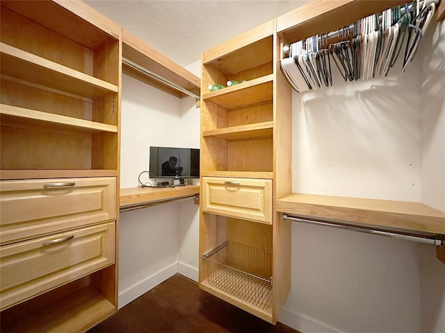 walk in closet featuring built in desk