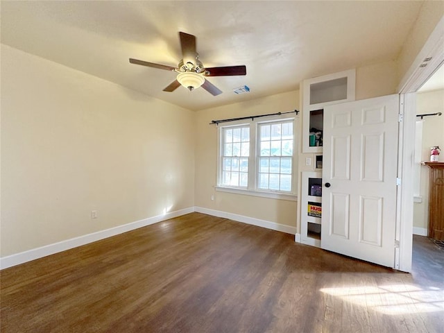 foyer featuring dark wood-type flooring and ceiling fan