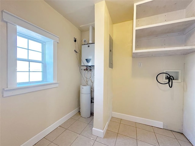 laundry room featuring light tile patterned floors, hookup for a washing machine, electric panel, and water heater