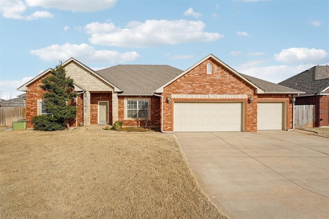 view of front of home with a garage and a front yard