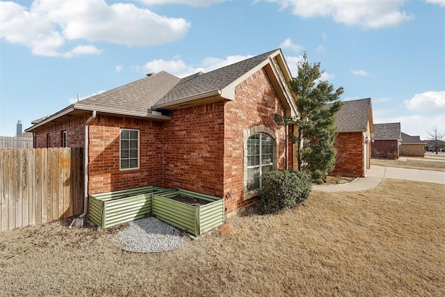 view of side of property featuring a yard