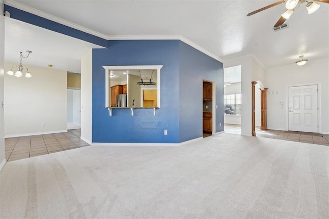 unfurnished living room with crown molding, ceiling fan with notable chandelier, and light colored carpet