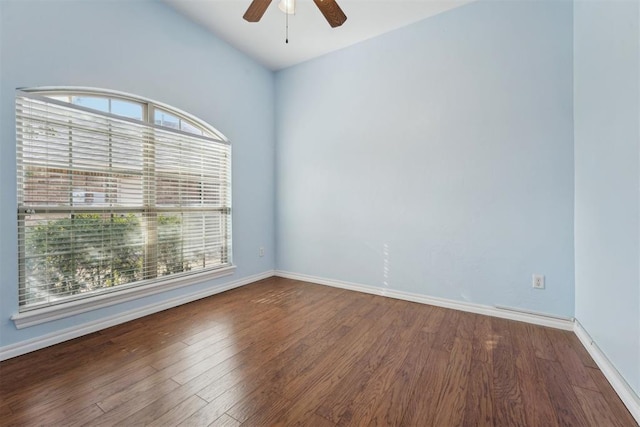 unfurnished room with dark wood-type flooring and ceiling fan