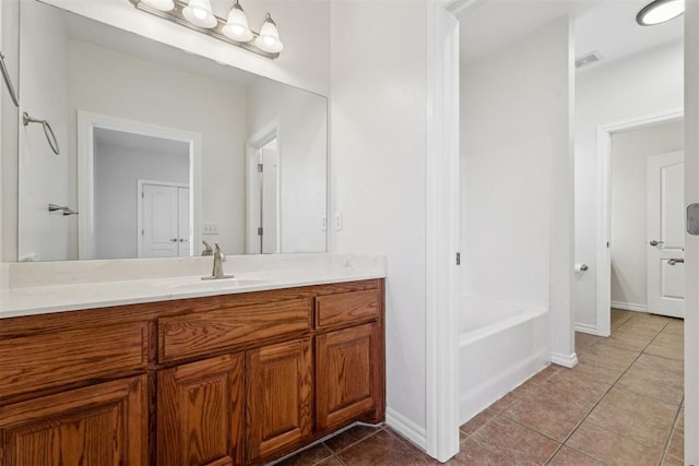 bathroom with tile patterned flooring and vanity