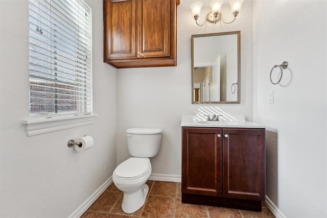 bathroom with vanity, toilet, and tile patterned flooring