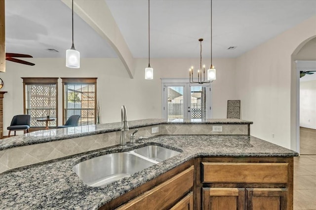 kitchen featuring pendant lighting, sink, and plenty of natural light