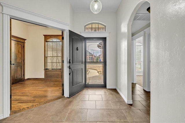 foyer featuring plenty of natural light and light hardwood / wood-style flooring