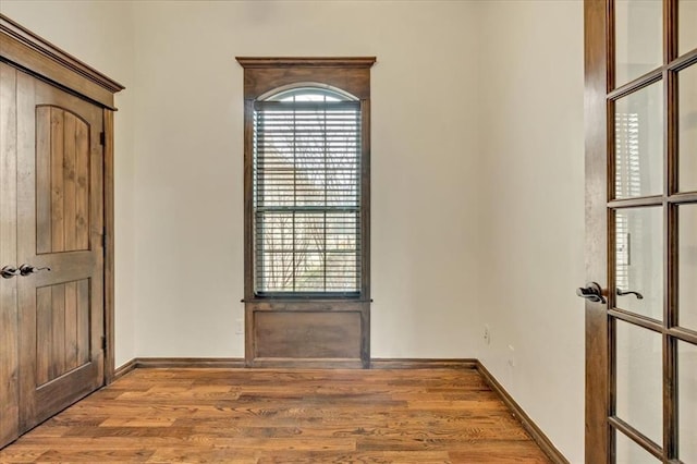 empty room featuring wood-type flooring