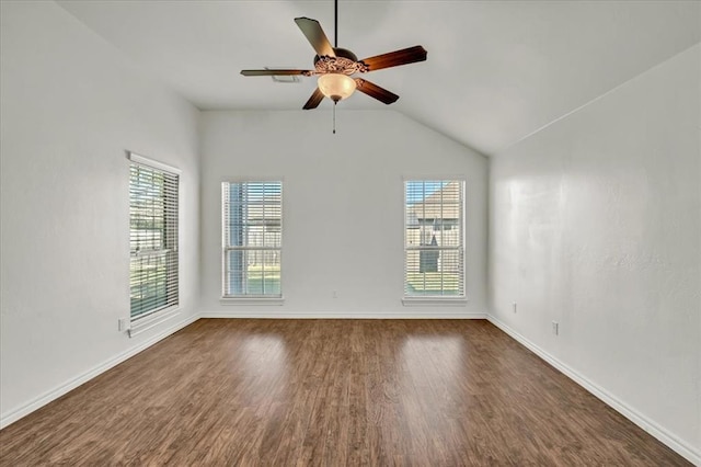 empty room featuring ceiling fan, lofted ceiling, and dark hardwood / wood-style flooring