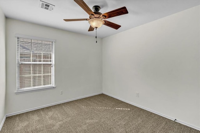 carpeted empty room featuring ceiling fan