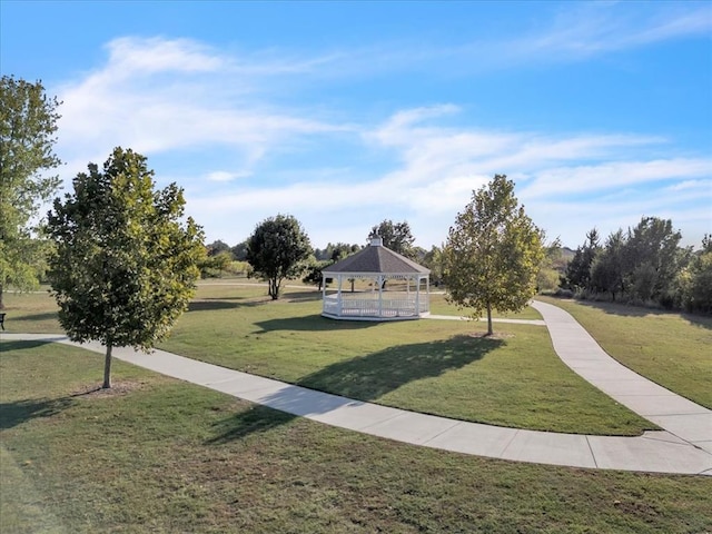 view of property's community with a gazebo and a yard