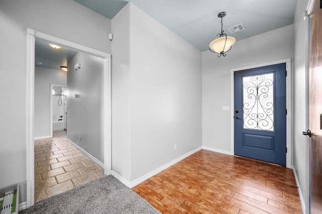 entrance foyer with hardwood / wood-style floors