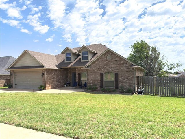 1828 Doc Bar Ave, Blanchard, OK 73010 - traditional home with brick siding, an attached garage, concrete driveway, and a shingled roof