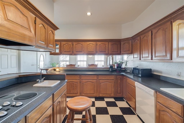 414315 E 1080th Rd, Checotah, OK 74426 - kitchen with white dishwasher, black microwave, light flooring, and brown cabinetry