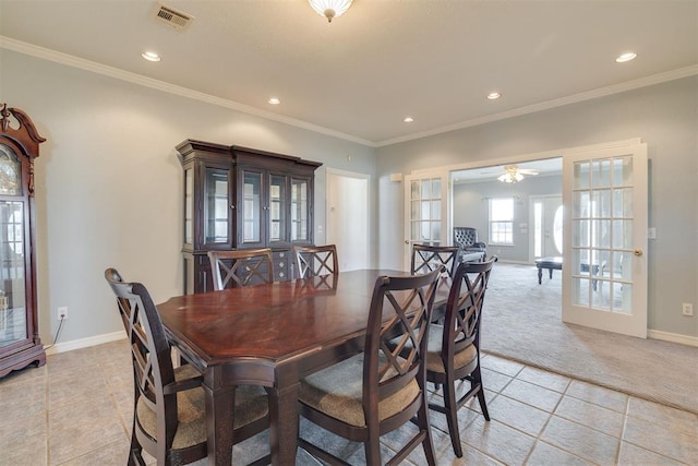 414315 E 1080th Rd, Checotah, OK 74426 - dining room with light tile patterned flooring, french doors, recessed lighting, light colored carpet, and crown molding