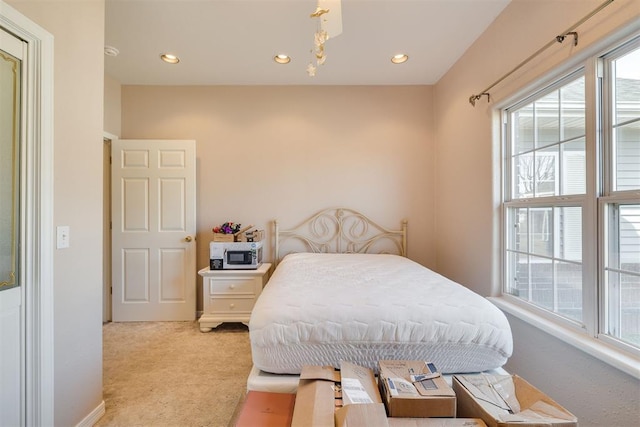 414315 E 1080th Rd, Checotah, OK 74426 - bedroom with light colored carpet, recessed lighting, and a chandelier