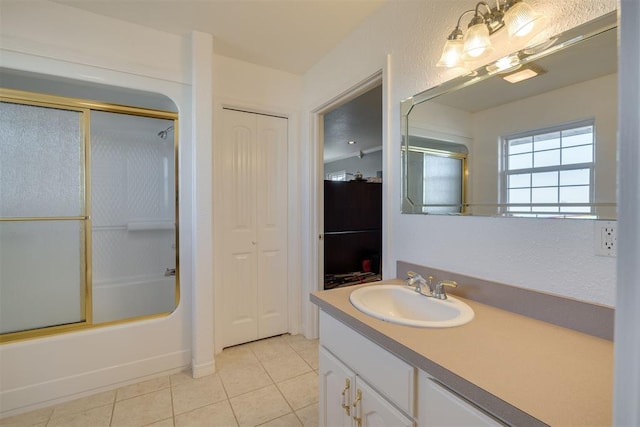 414315 E 1080th Rd, Checotah, OK 74426 - bathroom with tile patterned floors, vanity, shower / bath combination with glass door, and a closet