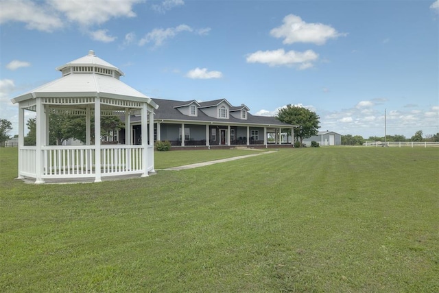 414315 E 1080th Rd, Checotah, OK 74426 - back of house featuring a gazebo, a yard, a porch, and a shingled roof