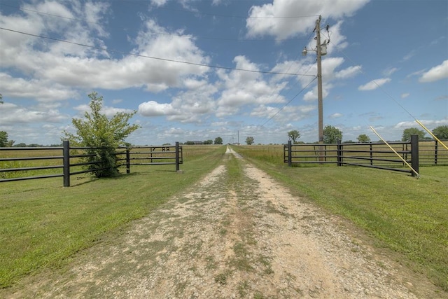 414315 E 1080th Rd, Checotah, OK 74426 - view of dirt / gravel road featuring a rural view and a gated entry