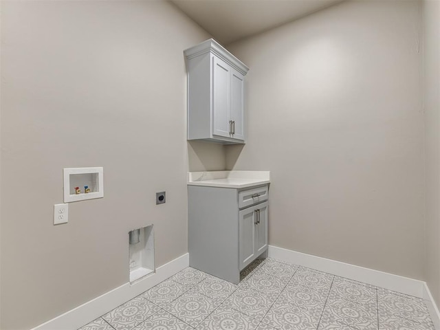 washroom featuring hookup for a washing machine, electric dryer hookup, light tile patterned floors, and cabinets