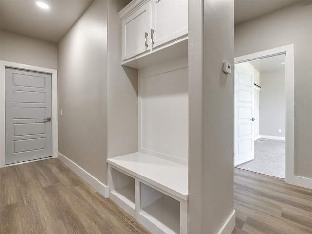 mudroom with light hardwood / wood-style flooring