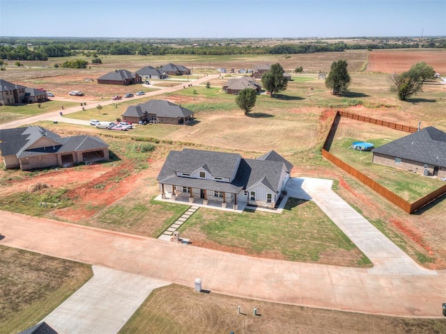 birds eye view of property with a rural view