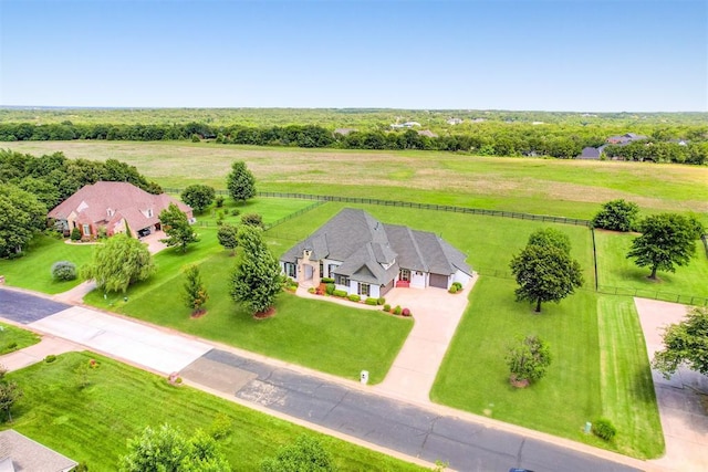 birds eye view of property with a rural view