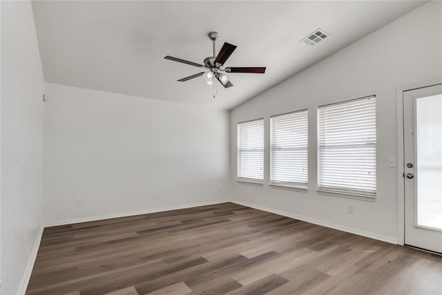 unfurnished room featuring vaulted ceiling, hardwood / wood-style floors, and ceiling fan