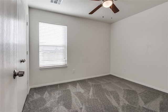 carpeted spare room with ceiling fan