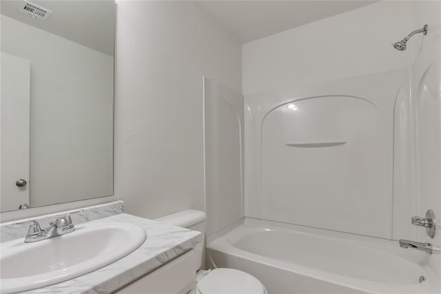 full bathroom with vanity, shower / bathing tub combination, and toilet