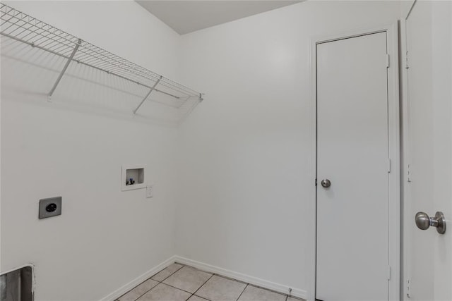 laundry room featuring light tile patterned floors, hookup for a washing machine, and electric dryer hookup