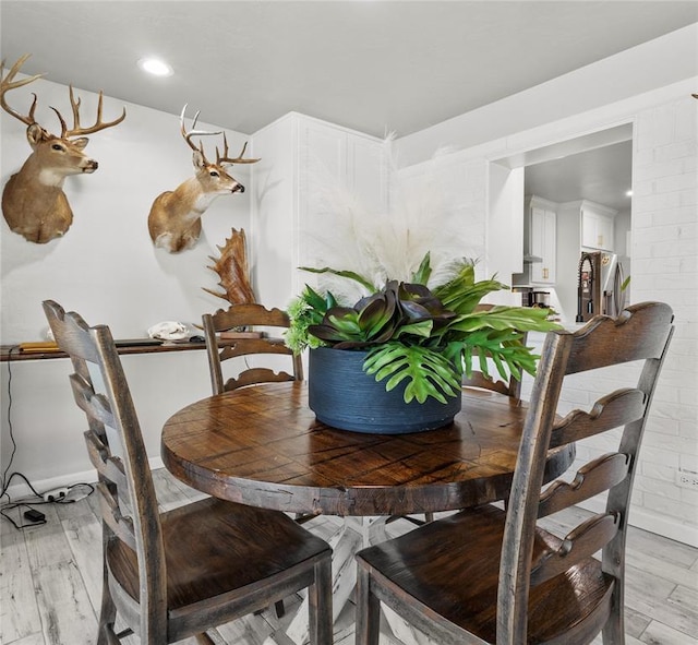 dining space featuring light wood-type flooring