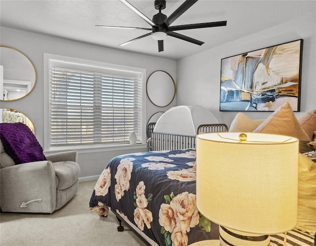 bedroom featuring ceiling fan, carpet floors, and baseboards