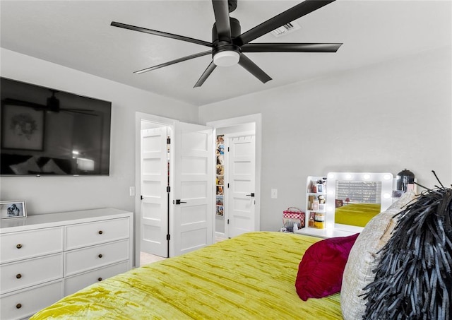 bedroom featuring ceiling fan and visible vents