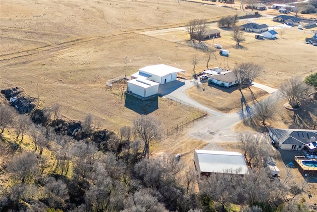 birds eye view of property featuring a rural view