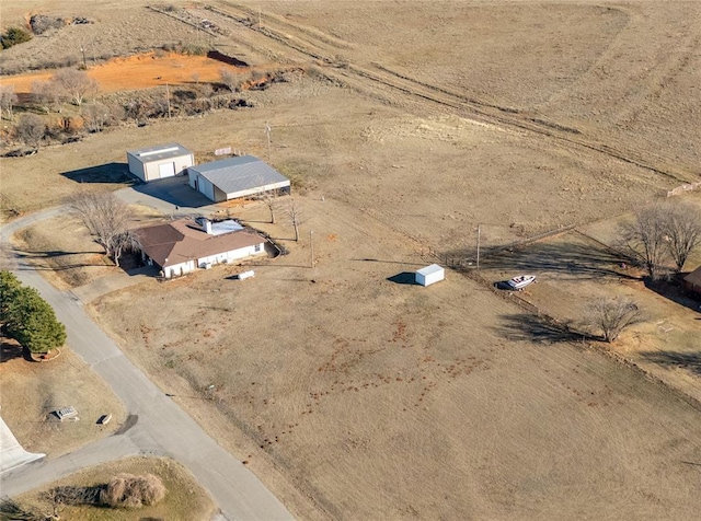 birds eye view of property featuring a rural view