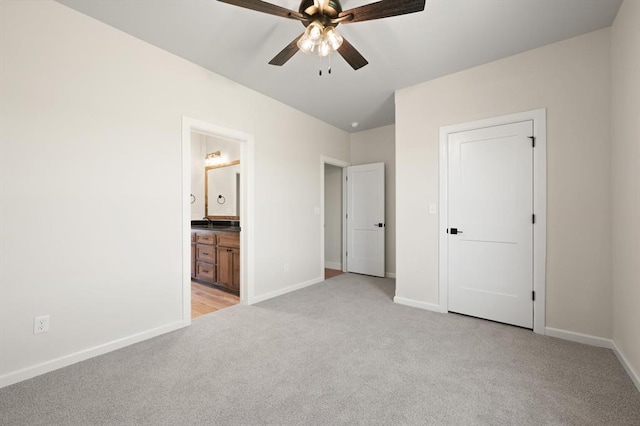 4341 Courtlyn Ave, Tuttle, OK 73089 - unfurnished bedroom with light colored carpet, baseboards, connected bathroom, and a ceiling fan