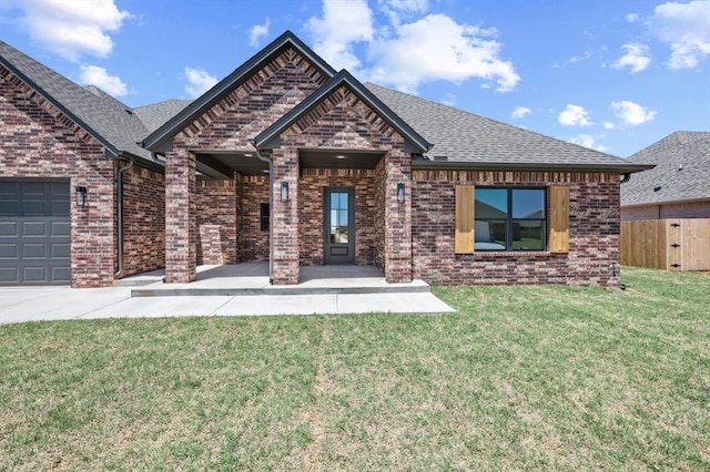 4341 Courtlyn Ave, Tuttle, OK 73089 - view of front of property with brick siding, roof with shingles, and an attached garage