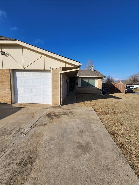 view of side of property featuring a garage