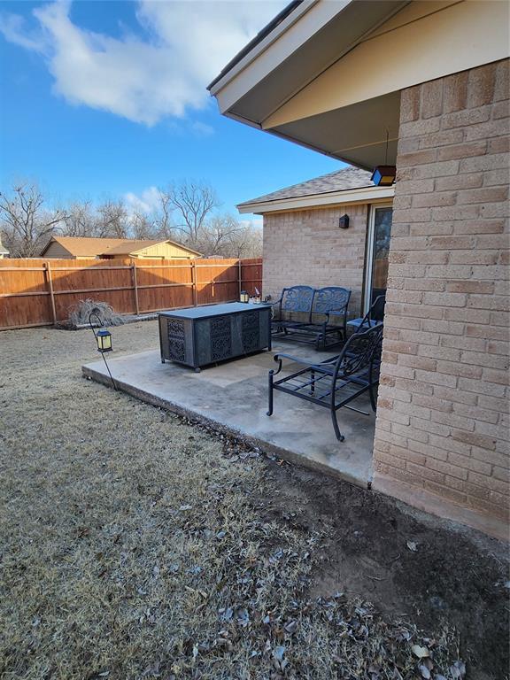 view of yard featuring a patio and a fire pit