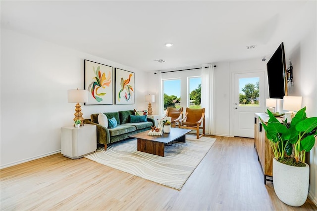 living room with light hardwood / wood-style floors