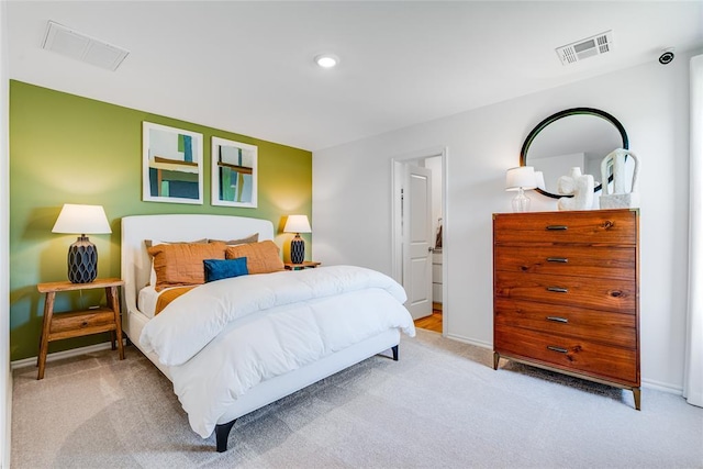 bedroom with light colored carpet