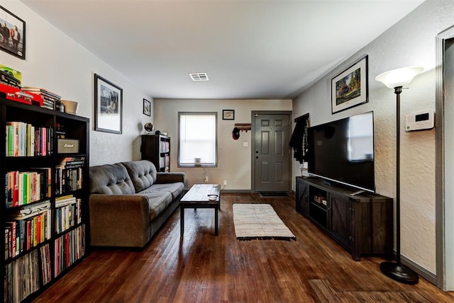 living room featuring dark hardwood / wood-style flooring